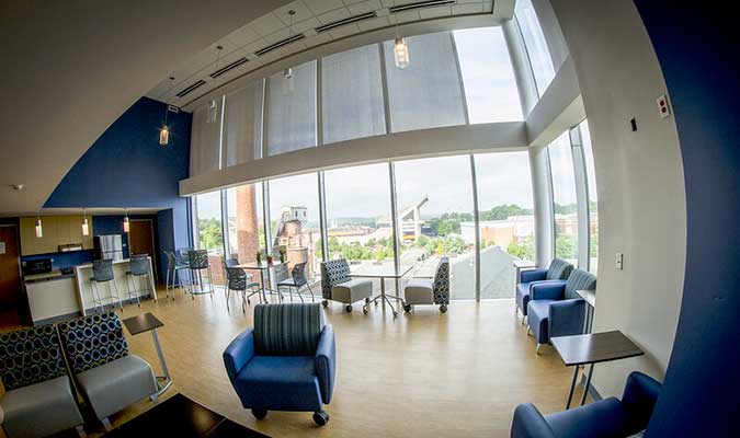 A photo of a community space and kitchen in the Honors Residential College. 