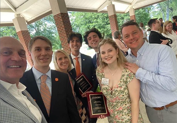 President Clements, Sr. Assoc. Dean Fine, Dean Winslow, Honors student Gabe Cutter, National Scholars Grant Wilkins and Gracie Boyce, and Dr. LeMahieu posing together for a selfie at the University awards event in 2023.