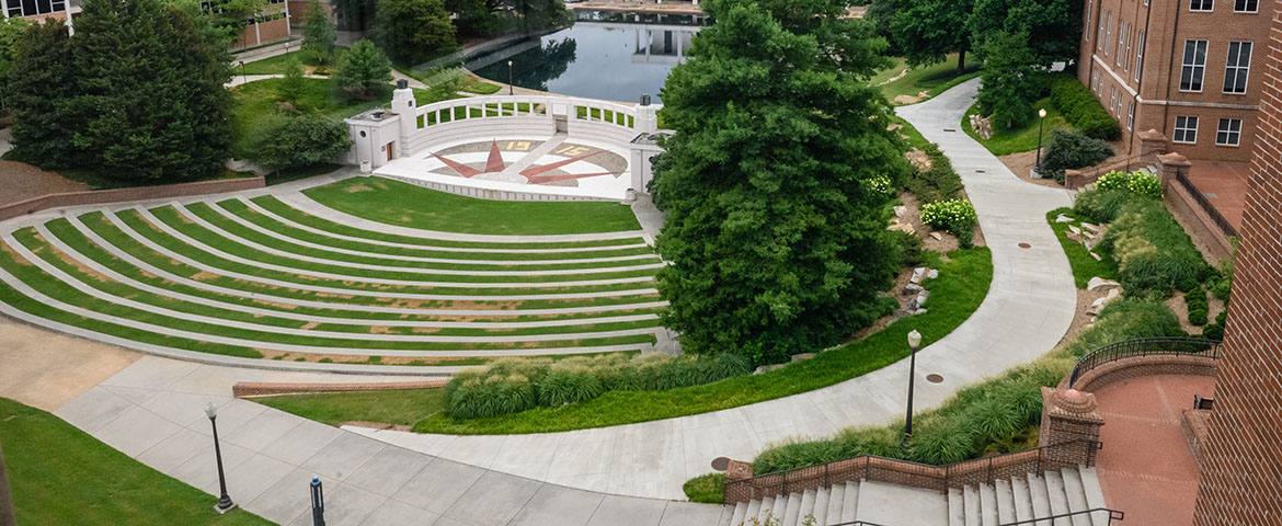 View of the amphitheater and reflection pond from second story of Brackett Hall.