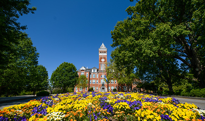 Tillman hall with flowers blooming out from