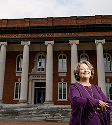Kim Wilkerson in front of Sikes Hall