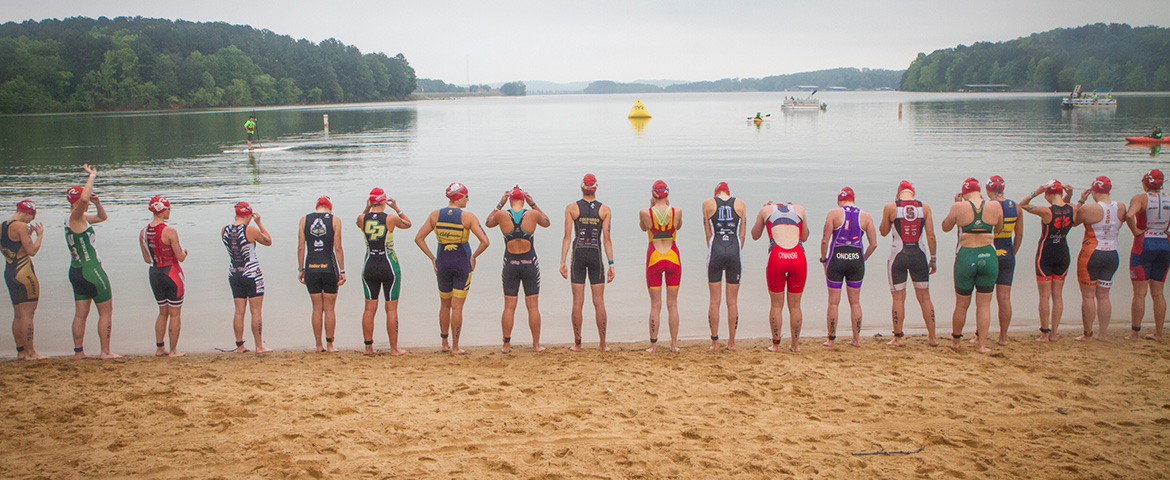Swimmers line up for the swim portion of a triathlon