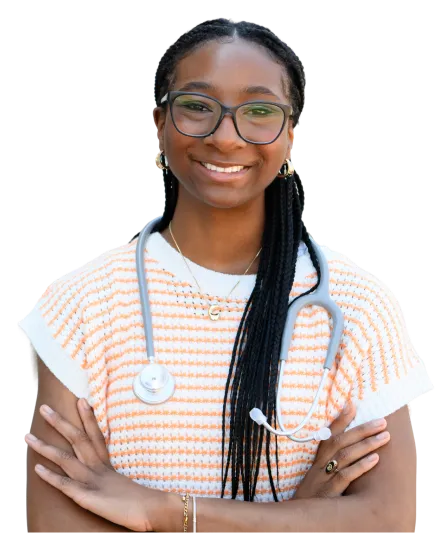 A female student wears an orange and white crocheted top and has a stethoscope around her neck.