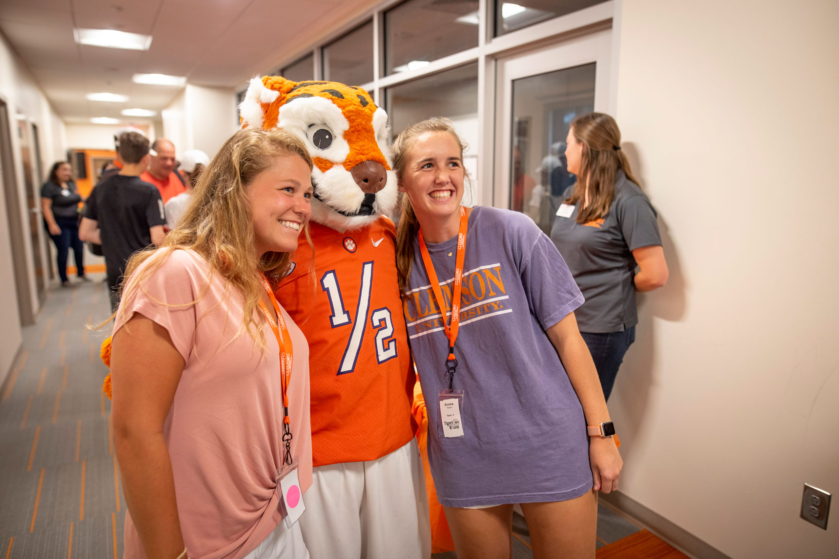 Two students pose with the Clemson Tiger mascot