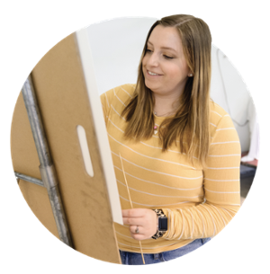 Sarah Grace Malphrus works at her easel