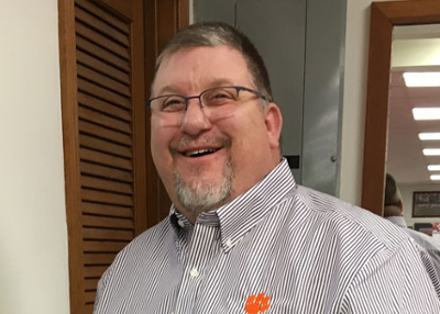 Anothony Pounder smiling in an office.