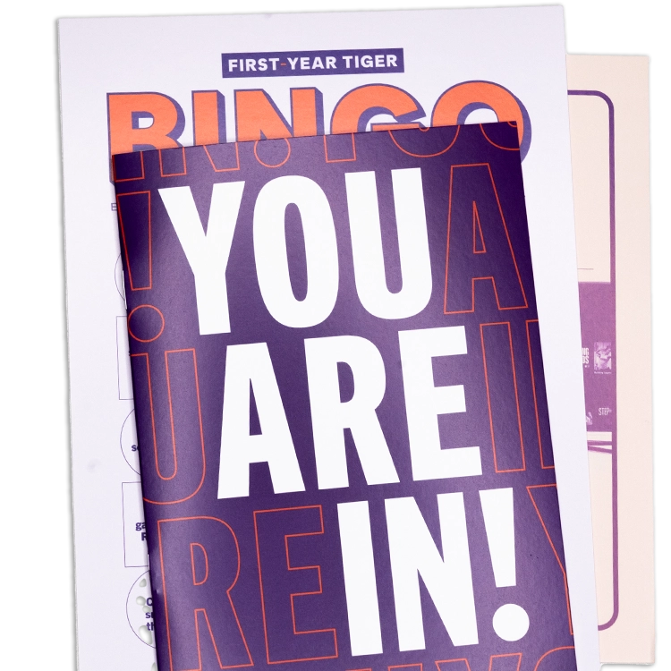 Clemson publication In These Hills and a Clemson-themed sticker set.