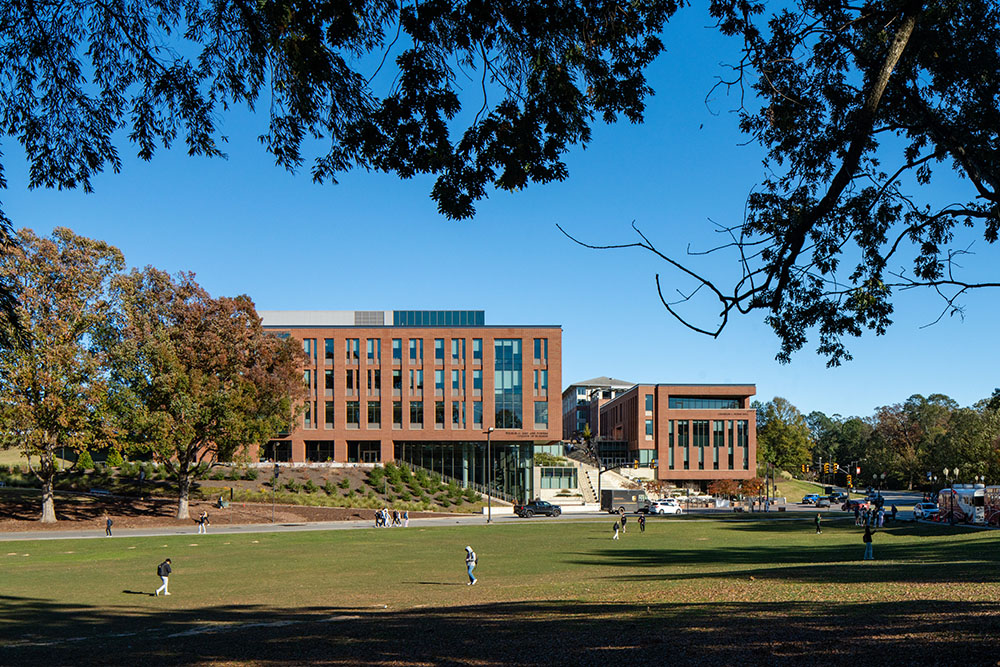 Modern architectural view of the Wilbur O. and Ann Powers College of Business building featuring large glass windows and brick exterior.