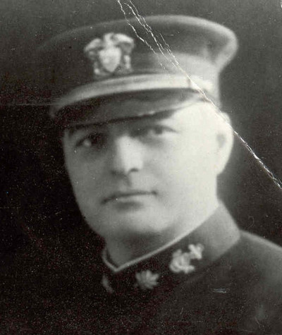 Black and white portrait of a military officer wearing a cap and uniform.