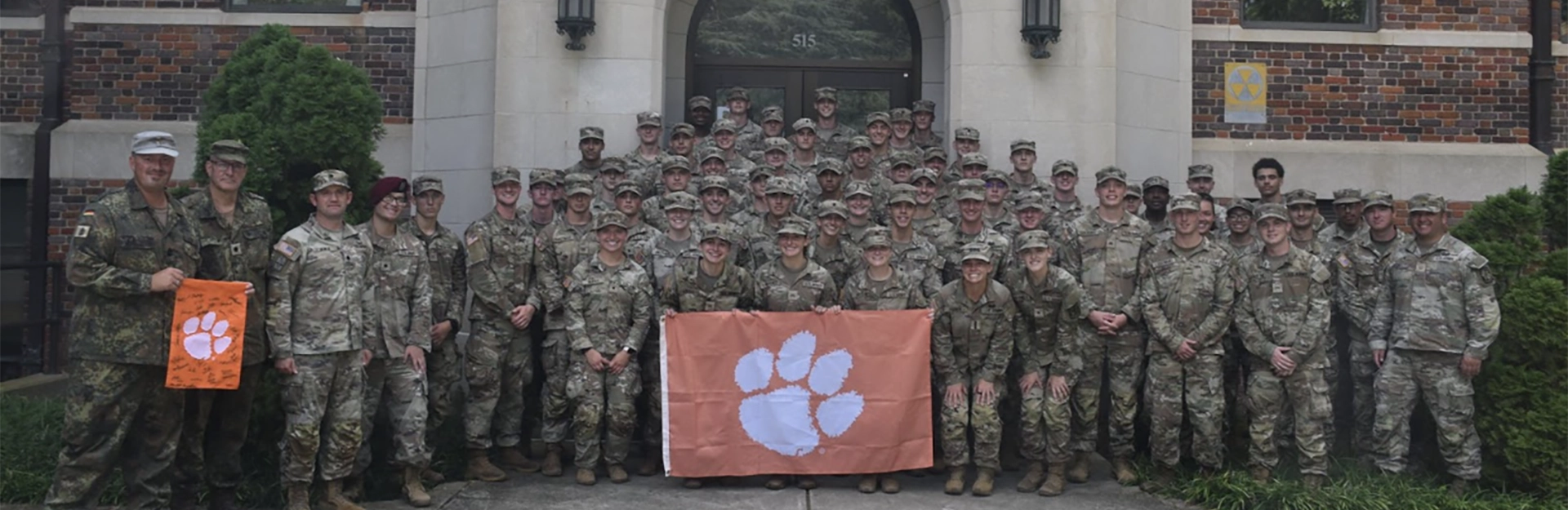 Cadets in camouflage marching.