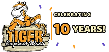 Tiger Express Wash logo with a cartoon tiger and a banner reading "Celebrating 10 Years!".