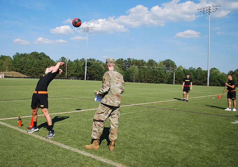 Cadets playing sports on soccer field.