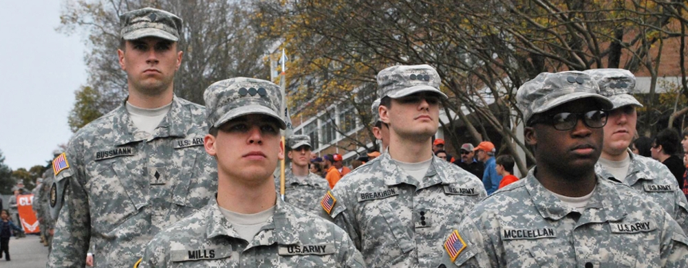 Cadets in camouflage marching.