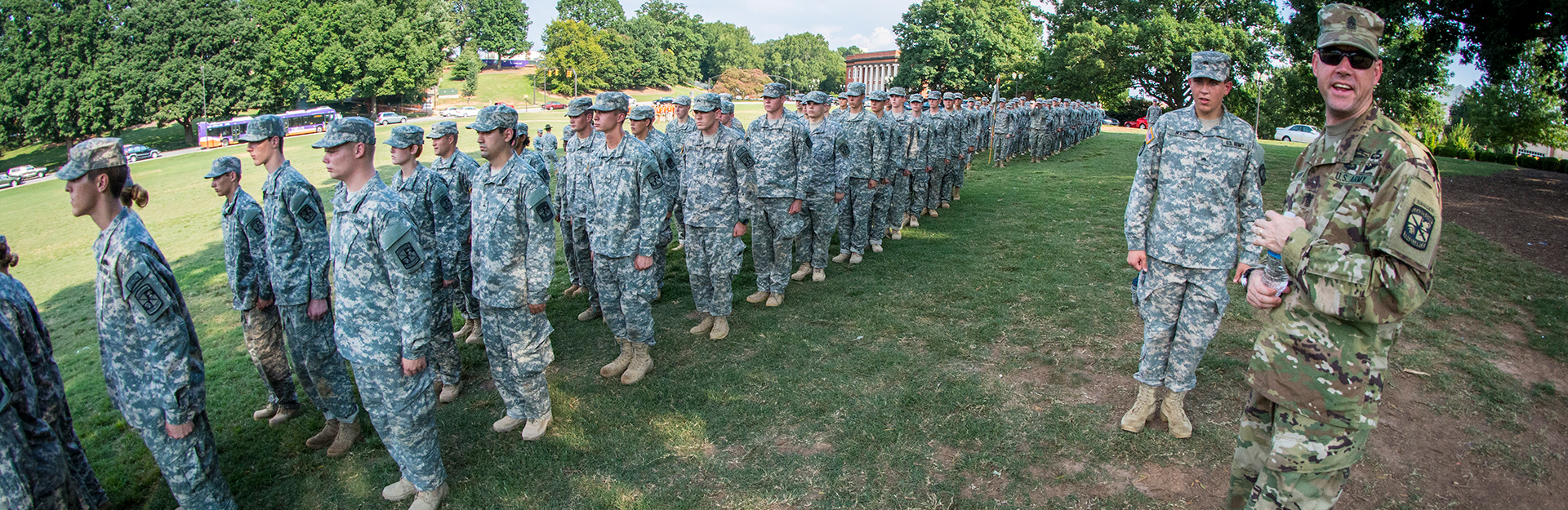 Cadets in camouflage marching in parade.