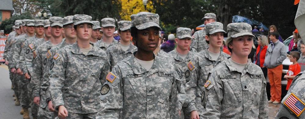 Cadets in camouflage marching.