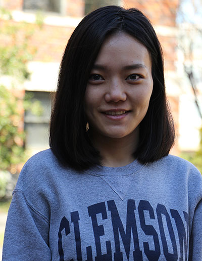 Portrait of a smiling woman wearing a Clemson University sweatshirt.