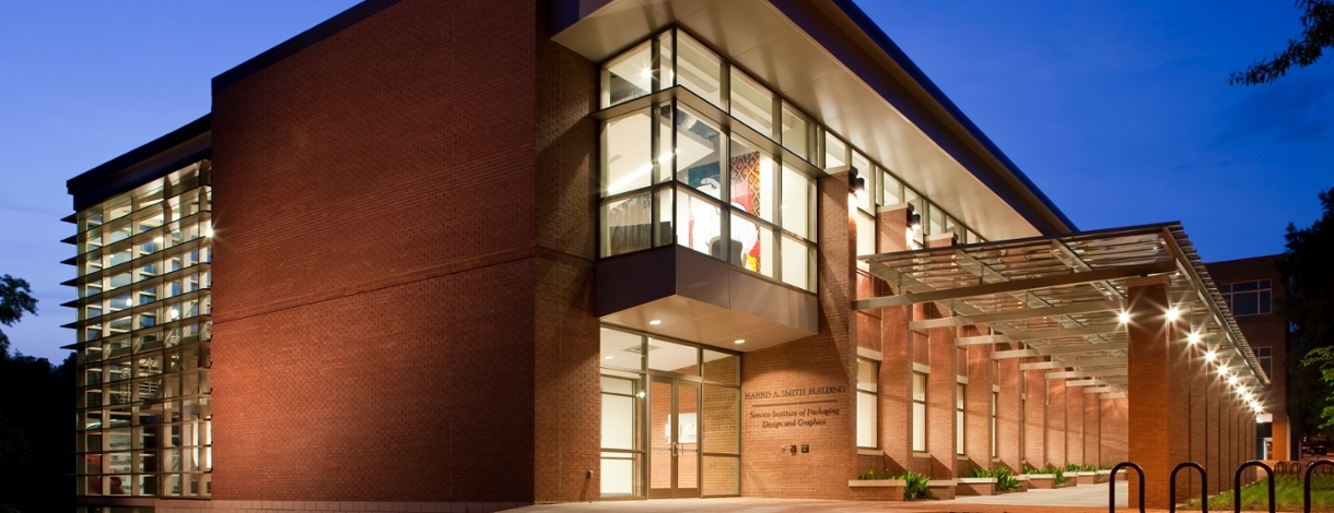 Front side of building at dusk.