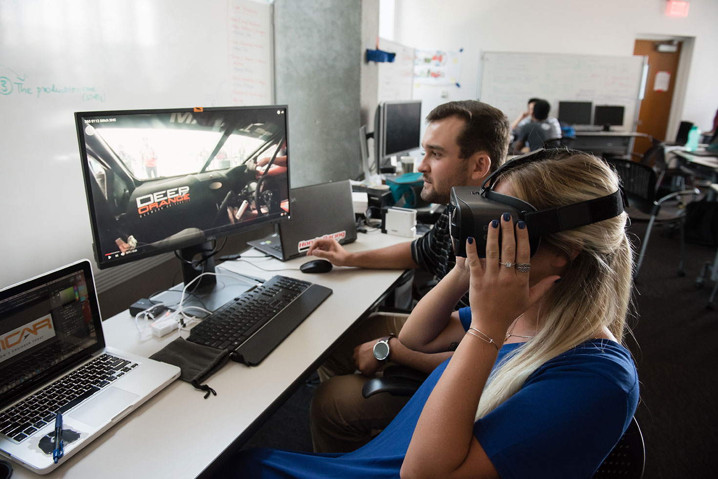 A female and male student using virtual reality technology.