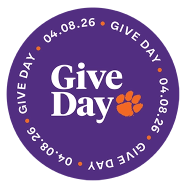 Purple circular Give Day logo with white “Give Day” text, orange paw print, and “04.08.26” around the edge.