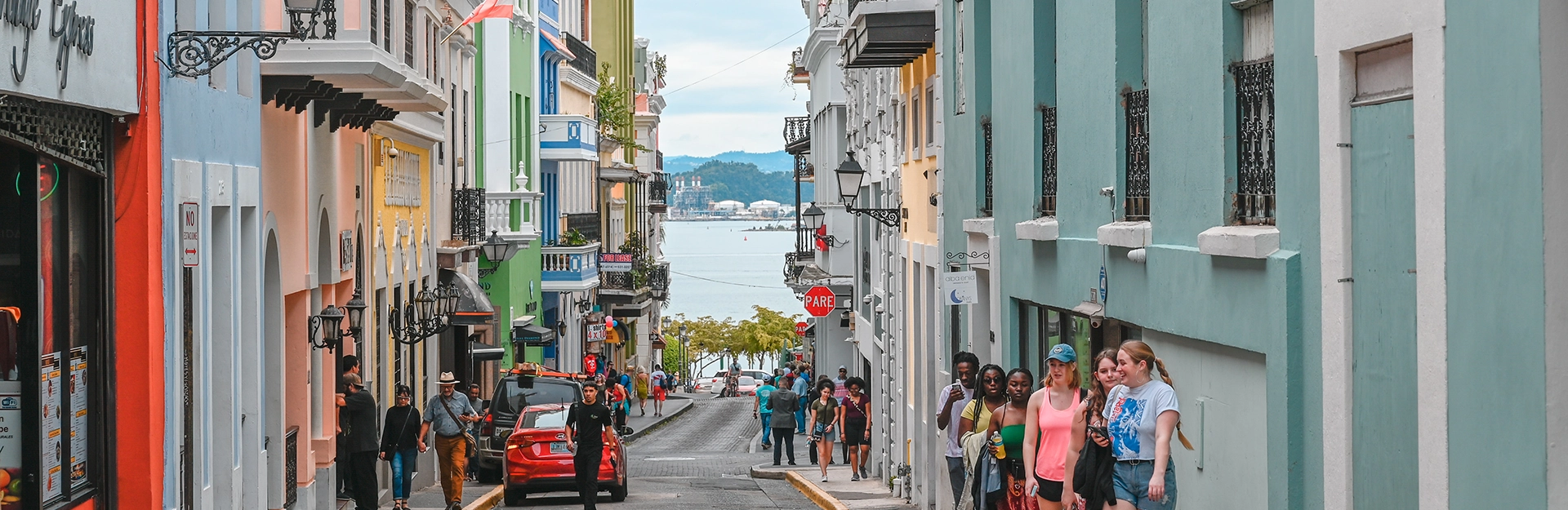 People walking down street of town in San Juan.
