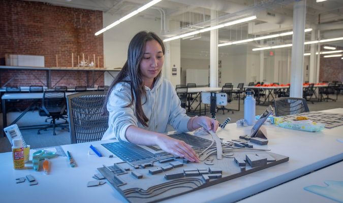 MRUD student works on cardboard project