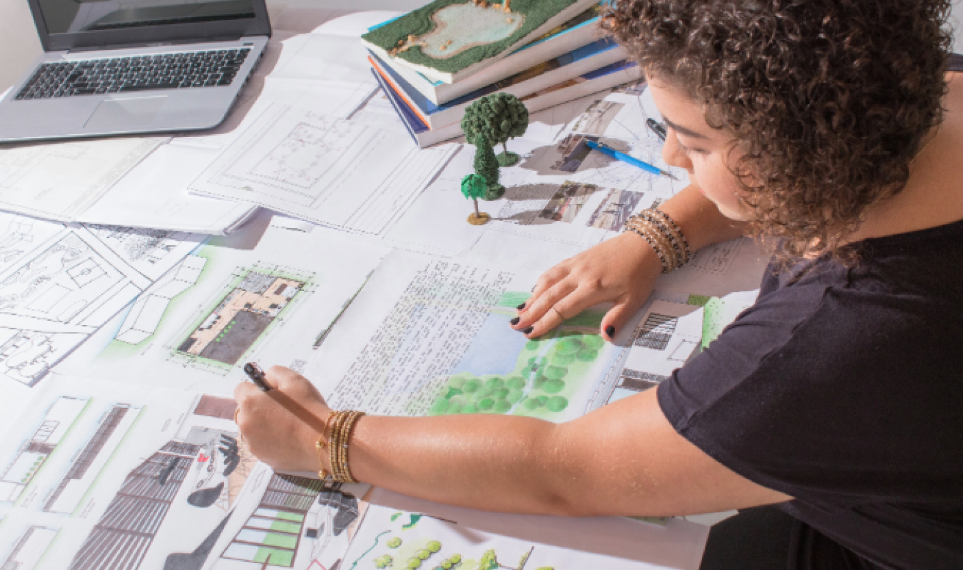 A student working on a city planning presentation.