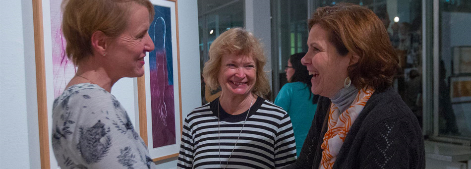 Woman talking and smiling in Lee Gallery
