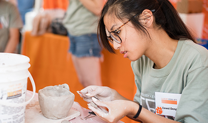 Art student creating pottery