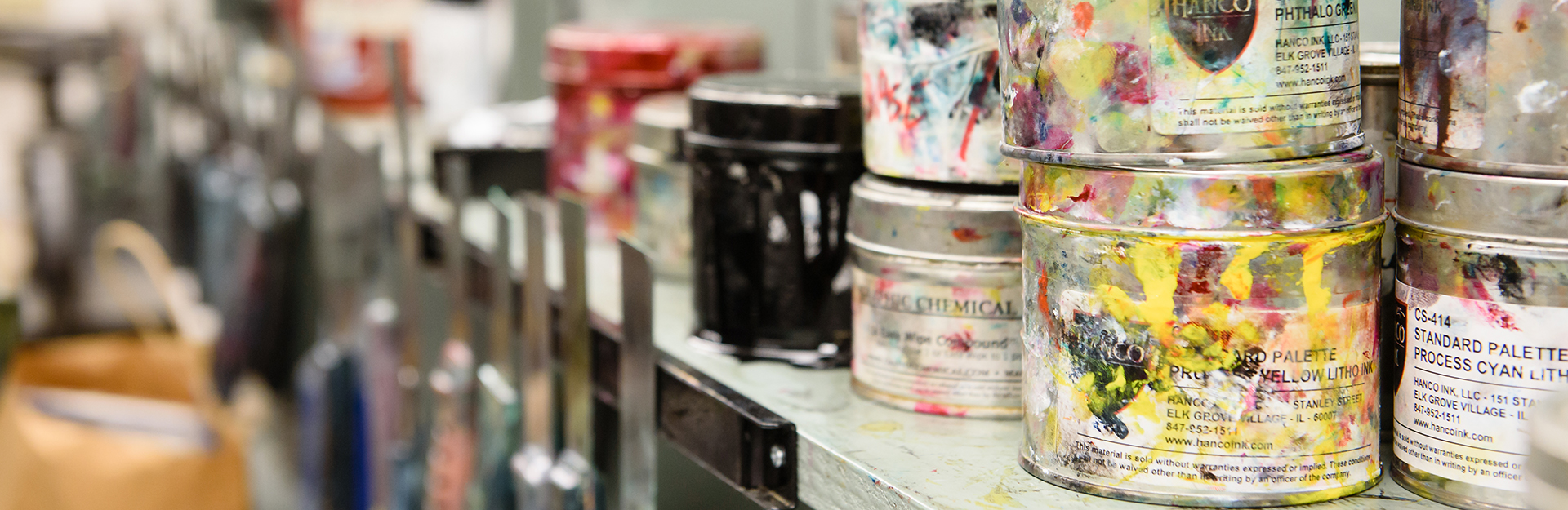 Image of paint cans on a shelf