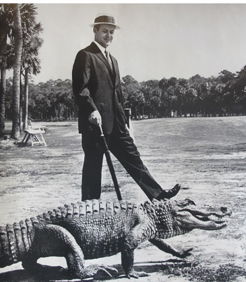 Charles Fraser walking with an alligator.