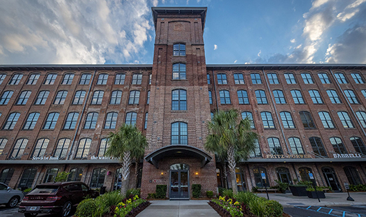 large brick building which houses Clemson Architecture center in Charleston