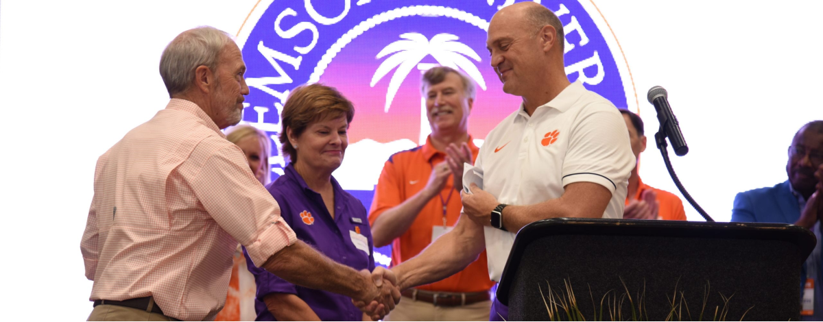 President Clements shaking hands with Mitchell Scott upon receiving $2.5M Academic Cornerstone for Clemson’s College of Agriculture, Forestry and Life Sciences to support scholarships