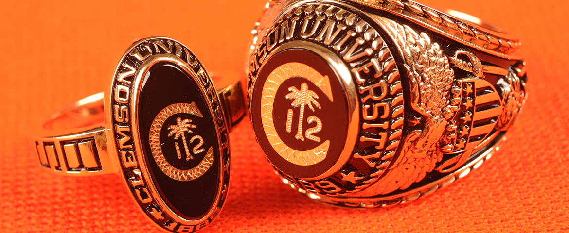 close up of Clemson class ring; palm tree and crescent moon with number 15 in diamonds