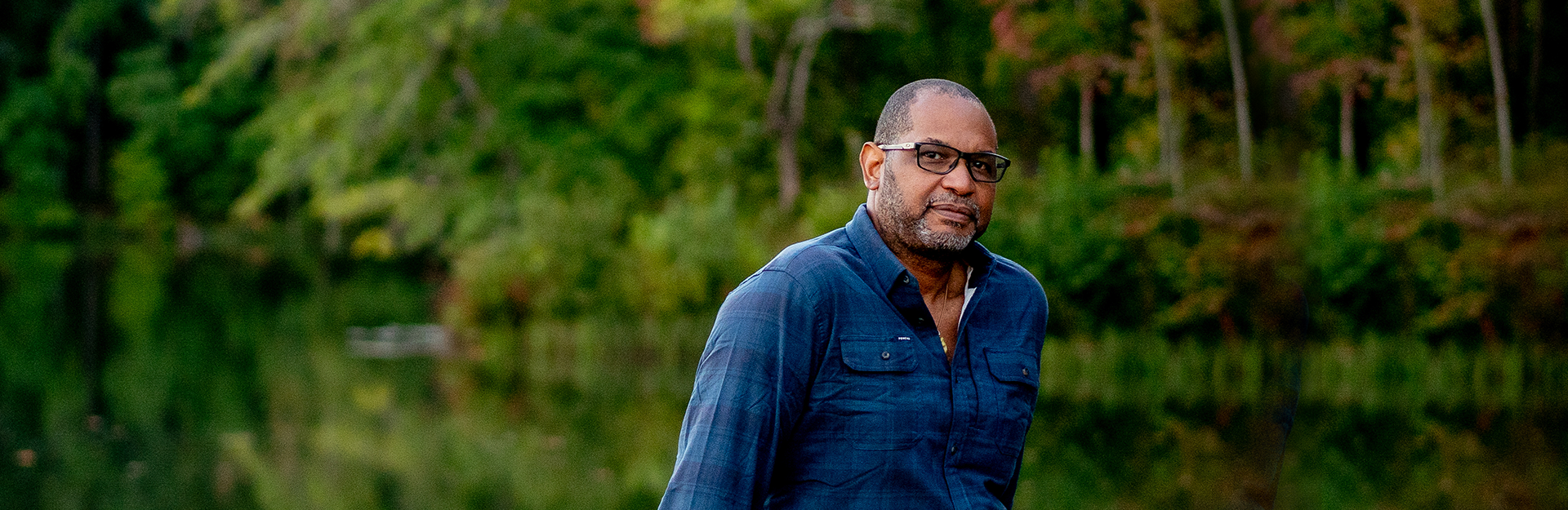 Dr. Drew Lanham standing in front a serene lake