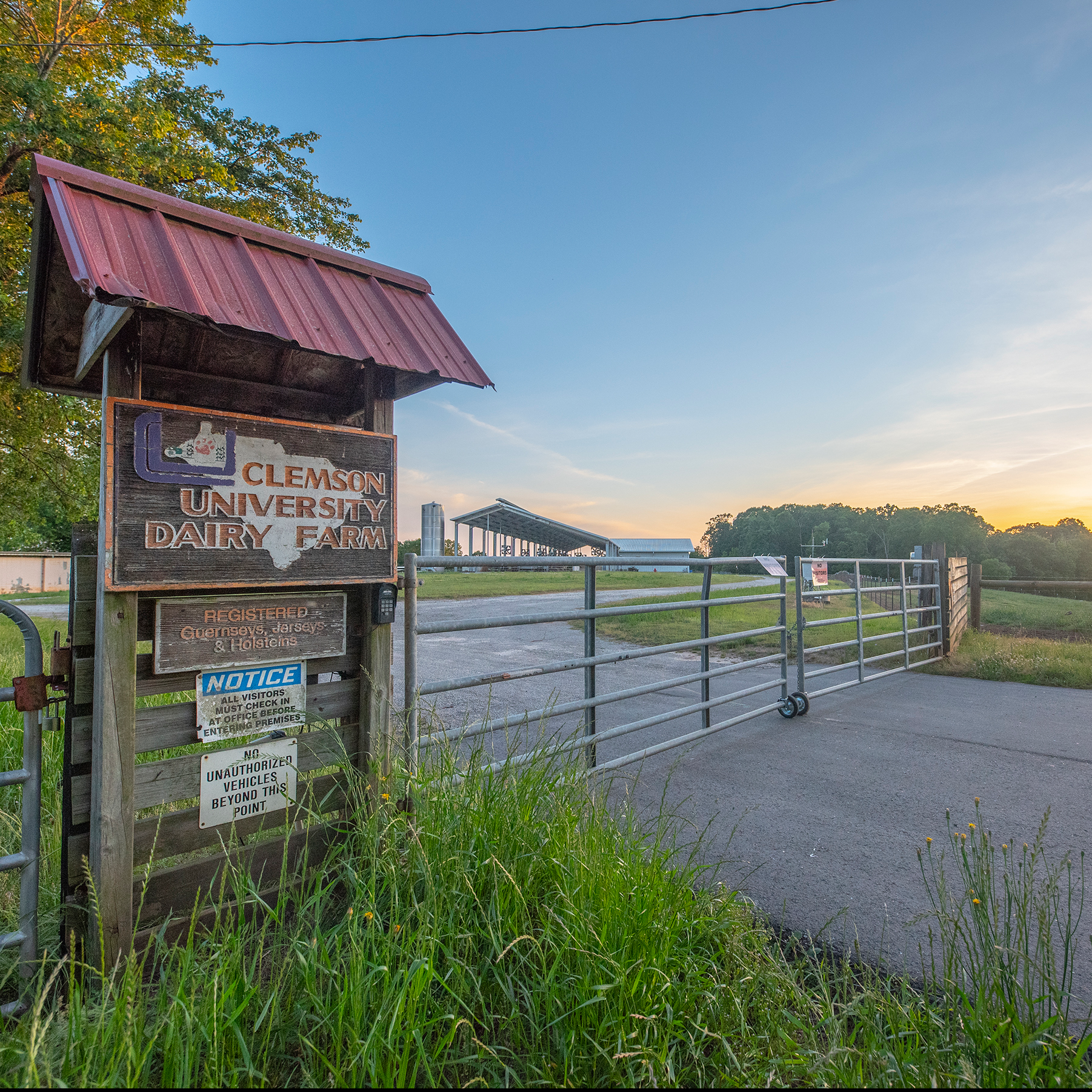 sign and gate at the entrance of lamaster dairy center