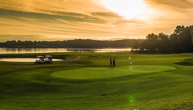 golf green at the walker course at sunset