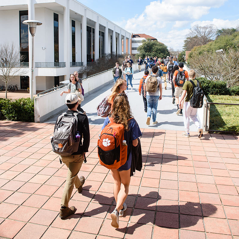 students walking in front of Cooper library