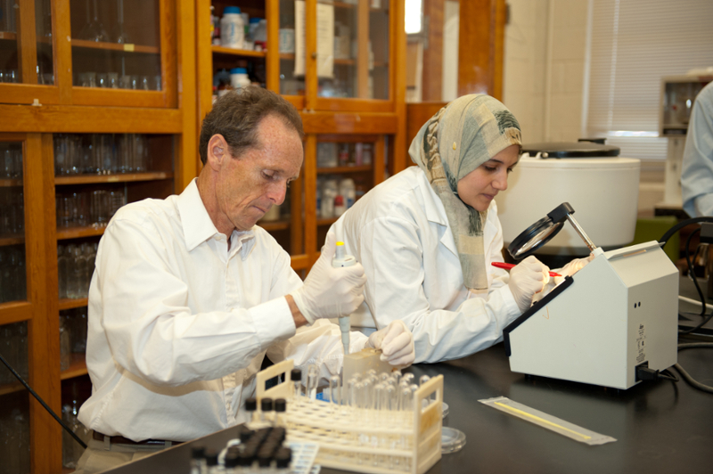 paul Dawson working with a student in a food science lab