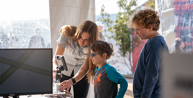 teacher helping students