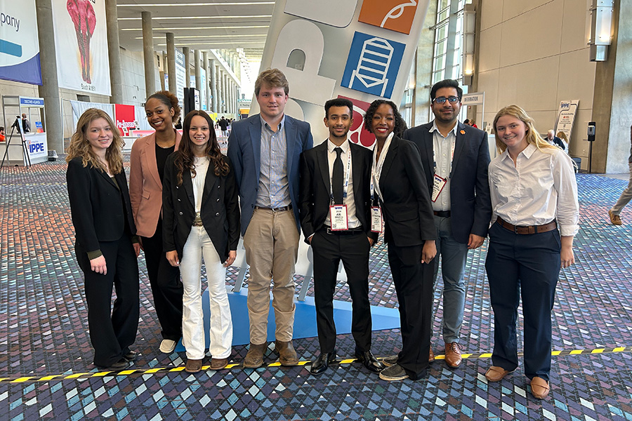Students standing in a conference building