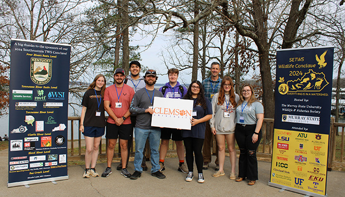 students surrounded by department branding