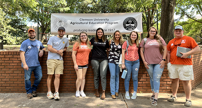 student teachers posing in agriculture quad on Clemson campus on teach ag day