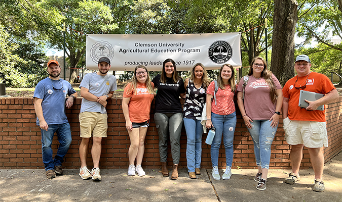 student teachers posing in agriculture quad on Clemson campus on teach ag day