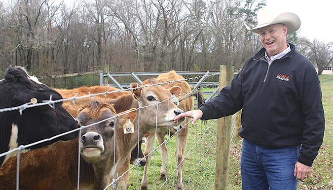 Matt Hersom Piedmont Rec director standing with cows