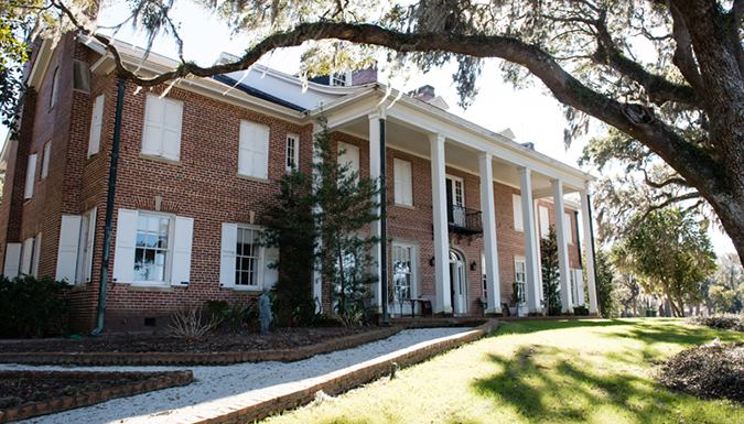 front entrance of 2-story brick home