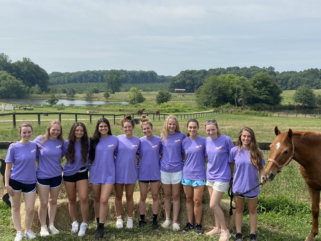 camp group photo with horse 