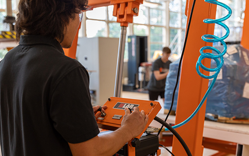 student operating machinery