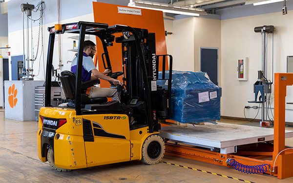 student operating machinery