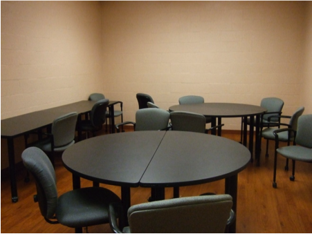 round tables with chairs in the focus group room for sensory lab