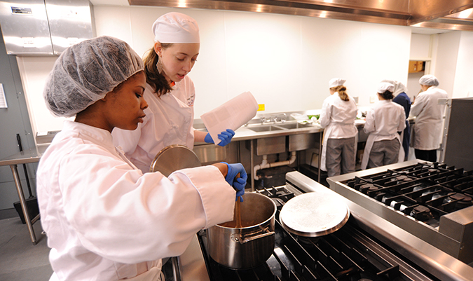 students cooking in culinary lab